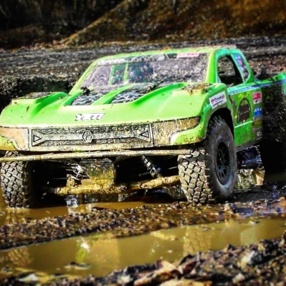 Green badass bashing trophy truck